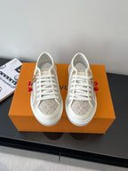 Louis Vuitton ladies lace-up sneakers, monogram canvas and white rubber sole