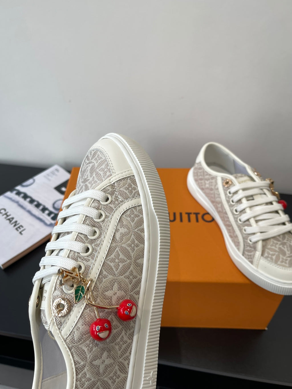 Louis Vuitton ladies sneakers, monogram canvas with gold lace charms and red beads