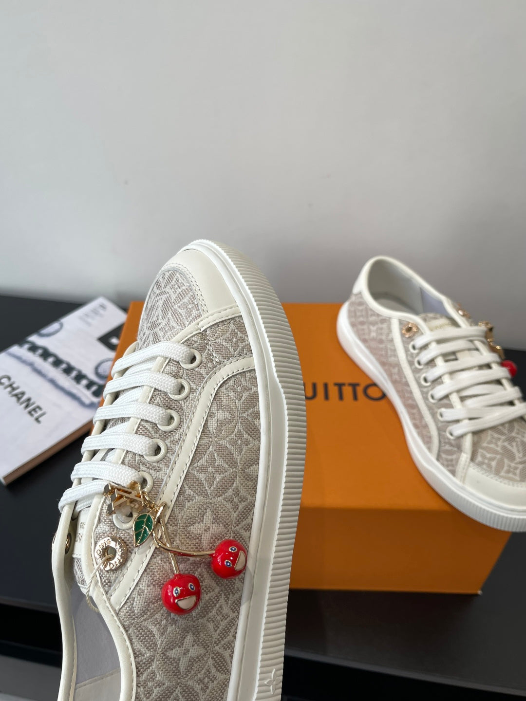 Louis Vuitton ladies sneakers, monogram canvas with gold lace charms and red beads