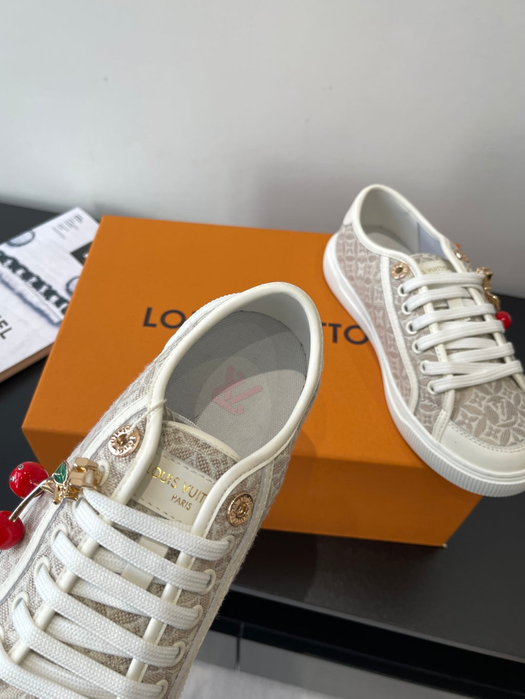 Louis Vuitton ladies lace-up sneakers, monogram canvas with gold hardware and charm