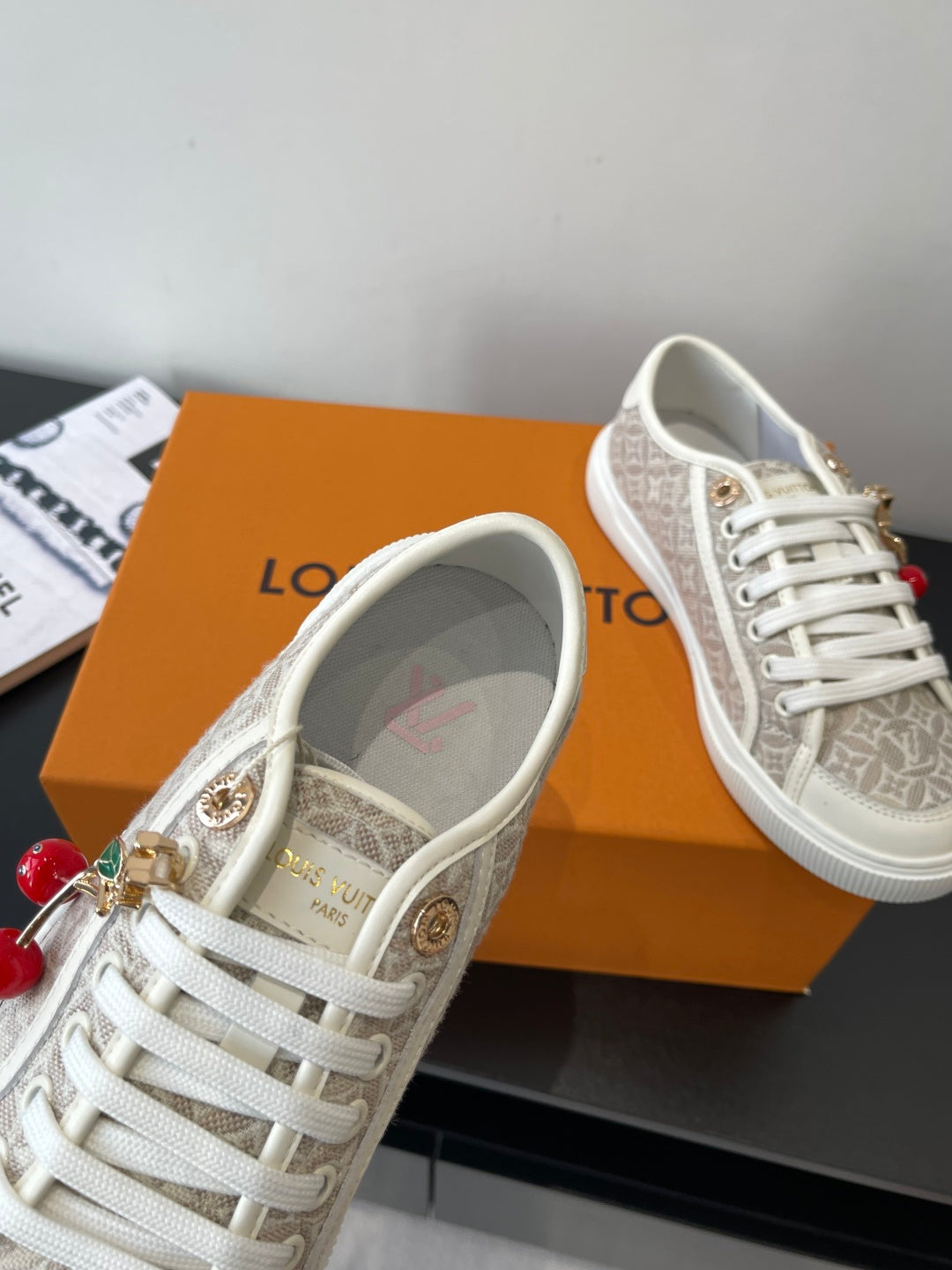 Louis Vuitton ladies lace-up sneakers, monogram canvas with gold hardware and charm