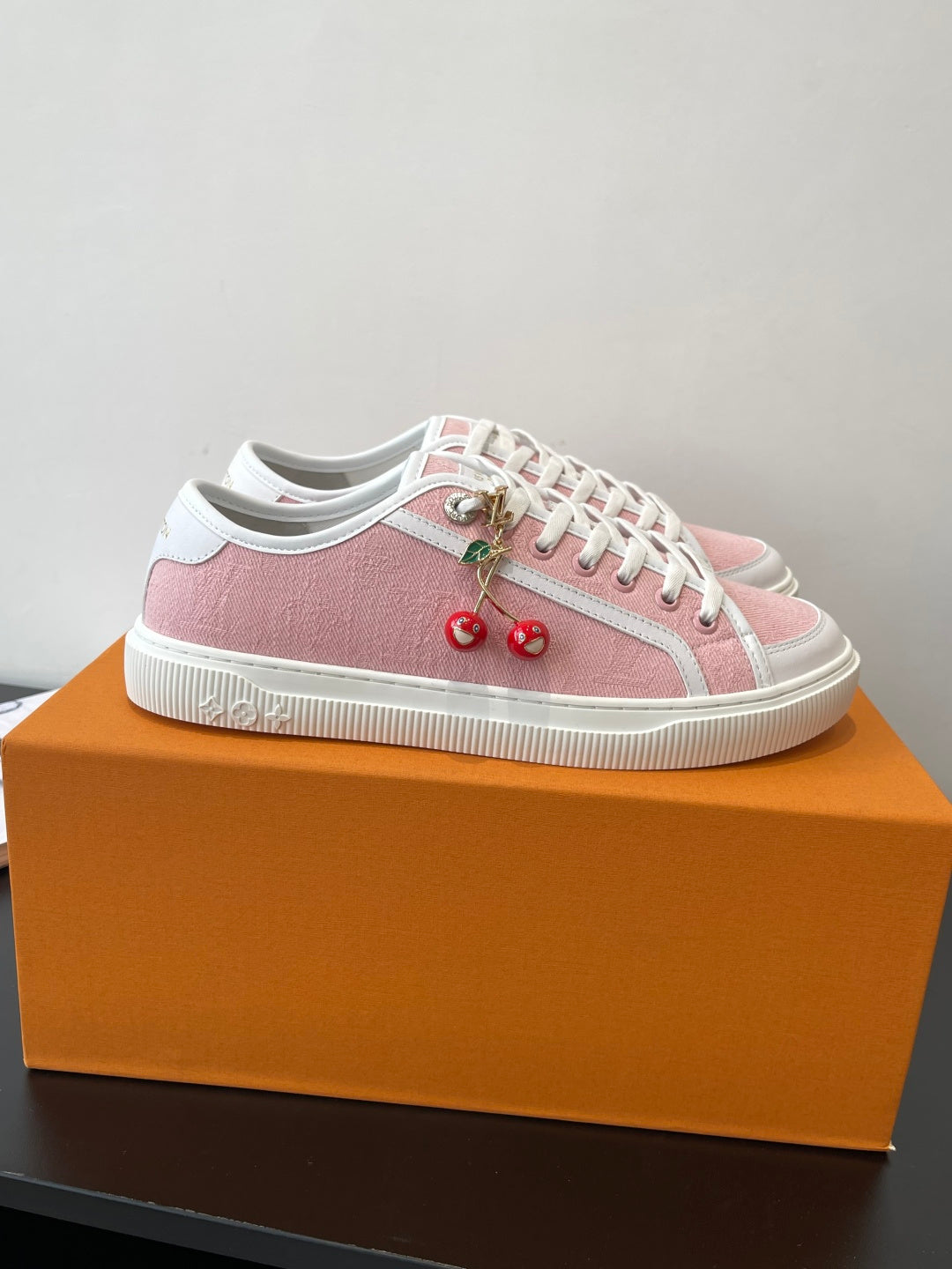 Women’s Louis Vuitton sneakers, pink upper with white toe cap and lace-up design