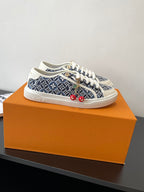 Louis Vuitton ladies sneakers in navy patterned canvas, white laces, red cherry charms