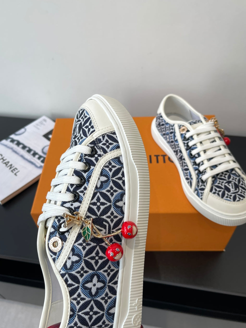 Louis Vuitton ladies sneakers, navy and white monogram print, white laces, red cherry charms
