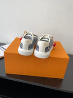 Louis Vuitton ladies sneakers, navy monogram canvas with white laces and red cherry charm details