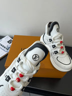 White sneakers with black inner lining, LV round logo, red beaded lace pulls