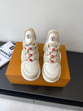 Louis Vuitton women's cream sneakers, lace-up with red bead charms and chunky sole