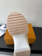 Louis Vuitton women's cream sneaker outsole tread, logo on heel area