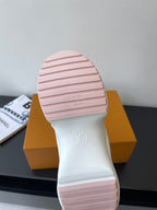 Pink-striped rubber outsole with Louis Vuitton logo on heel