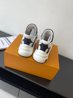 Back view of white and black sneakers with padded collars
