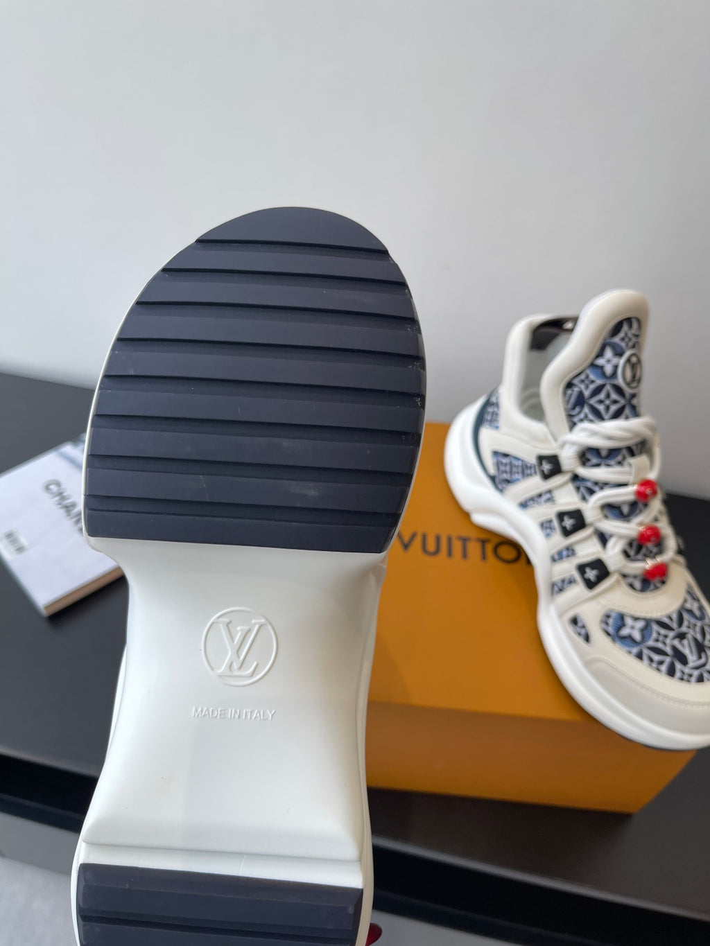 Louis Vuitton women's sneakers outsole view, white sole with navy tread and logo