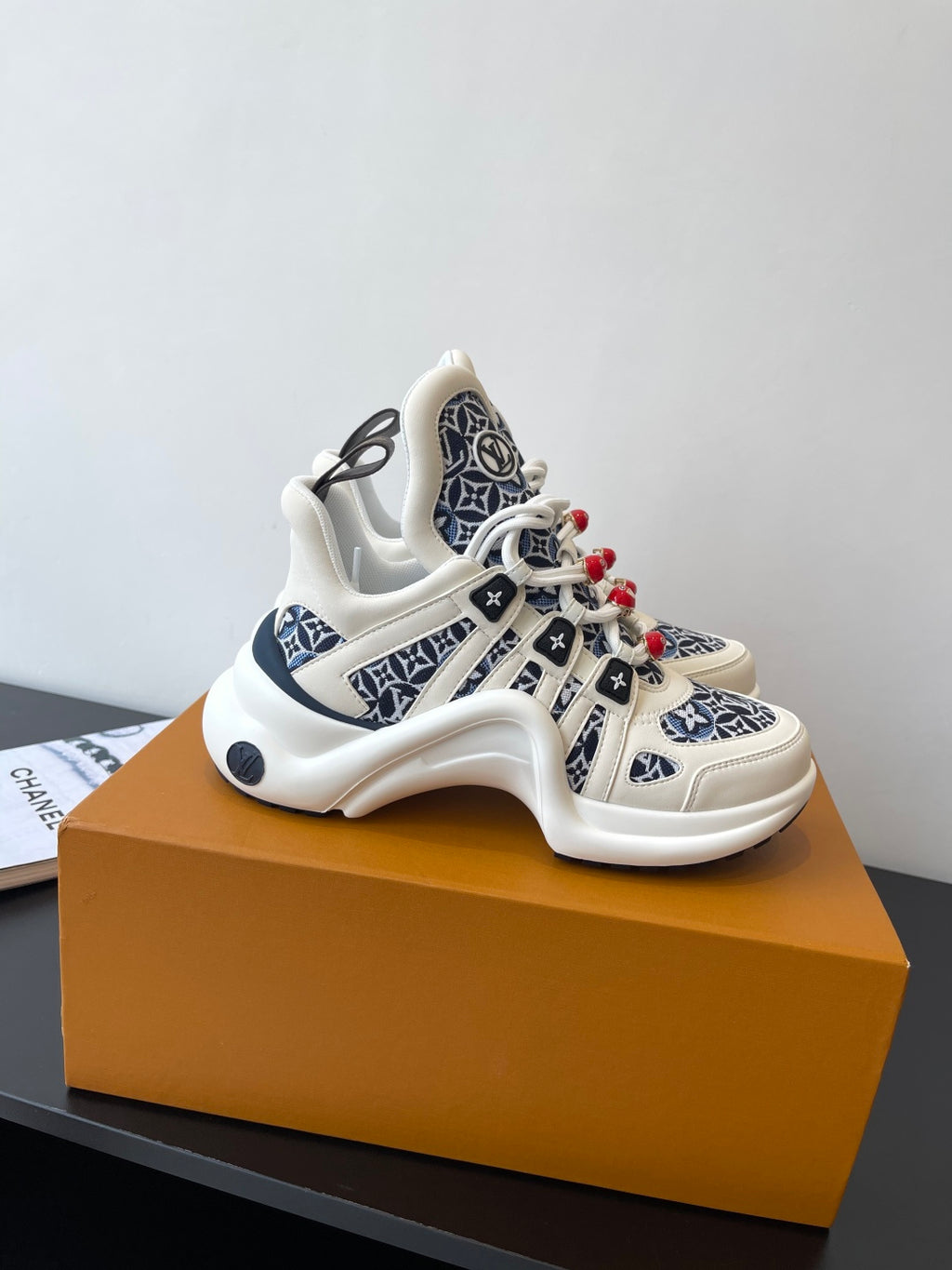 Louis Vuitton women's sneakers on box, white and navy monogram with red lace beads