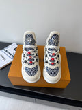 Louis Vuitton women's sneakers, white with navy monogram pattern and red lace accents