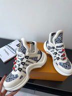 Louis Vuitton women's sneakers, white base with navy logo print, red lace details