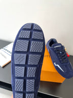 Louis Vuitton ladies navy sneakers, outsole view with grid tread and logo text