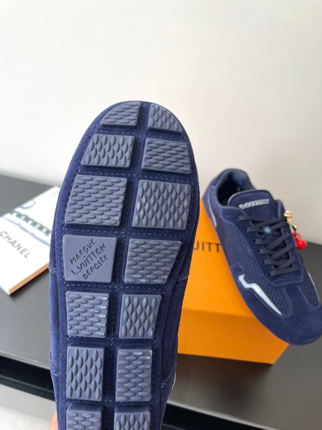 Louis Vuitton ladies navy sneakers, outsole view with grid tread and logo text