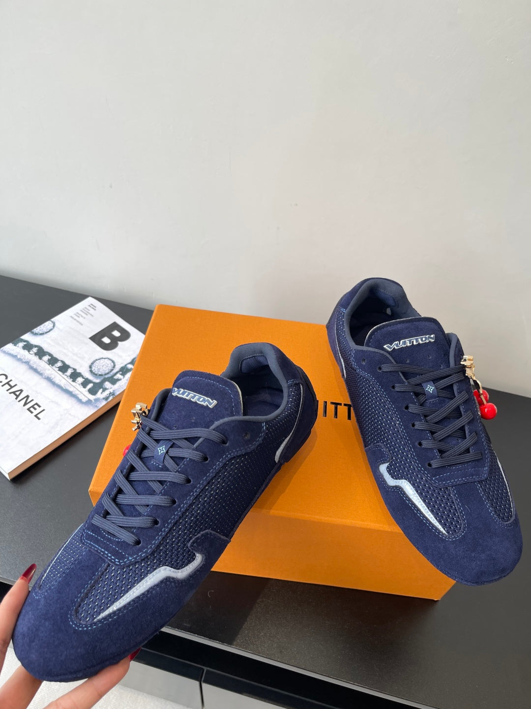 Louis Vuitton ladies navy sneakers, pair view with lace-up and side logo stripe