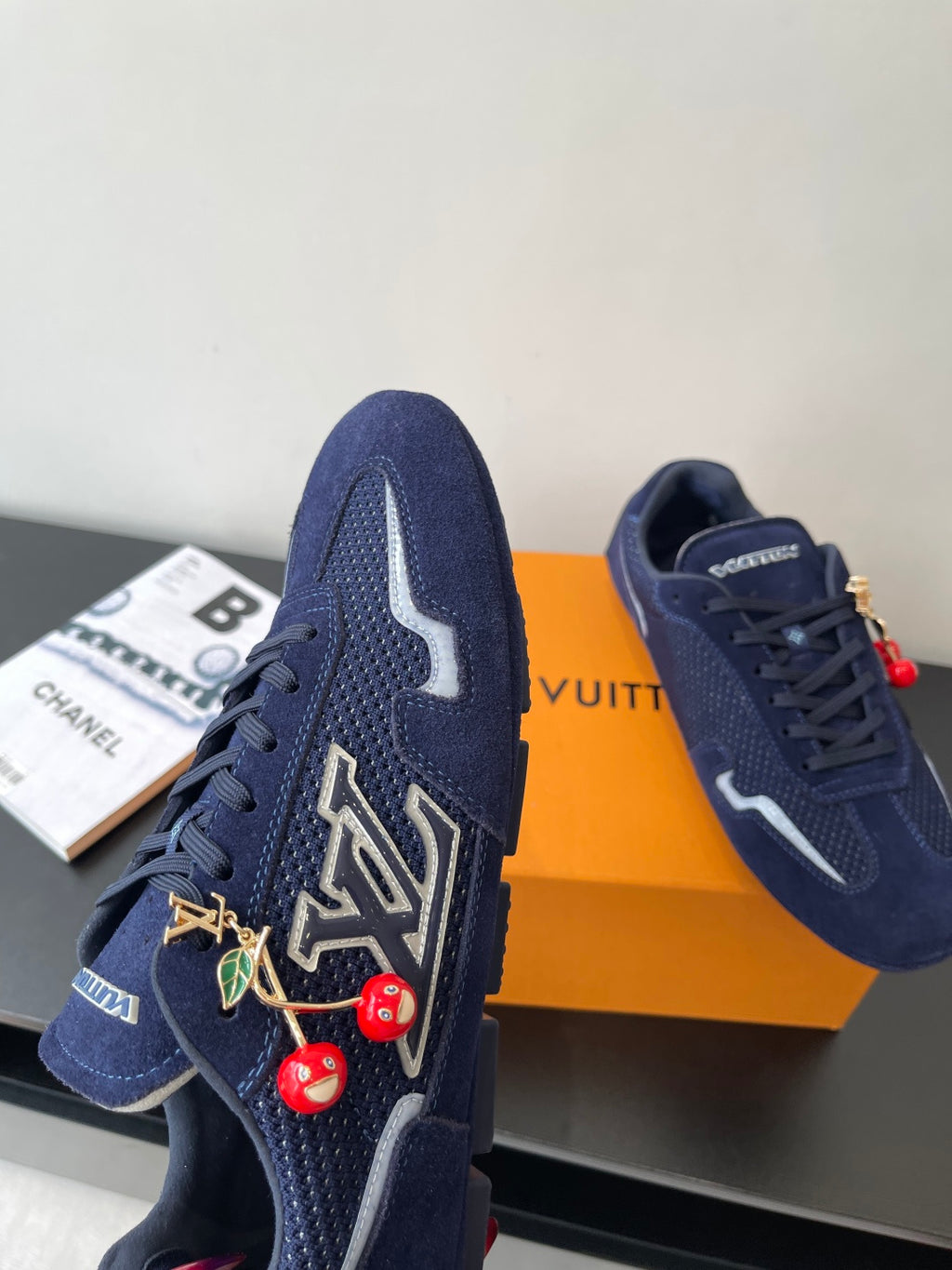 Louis Vuitton ladies navy sneakers, front view with lace-up and cherry charm