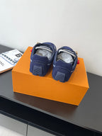 Louis Vuitton ladies navy sneakers, back view with heel tabs and laces, pair on box