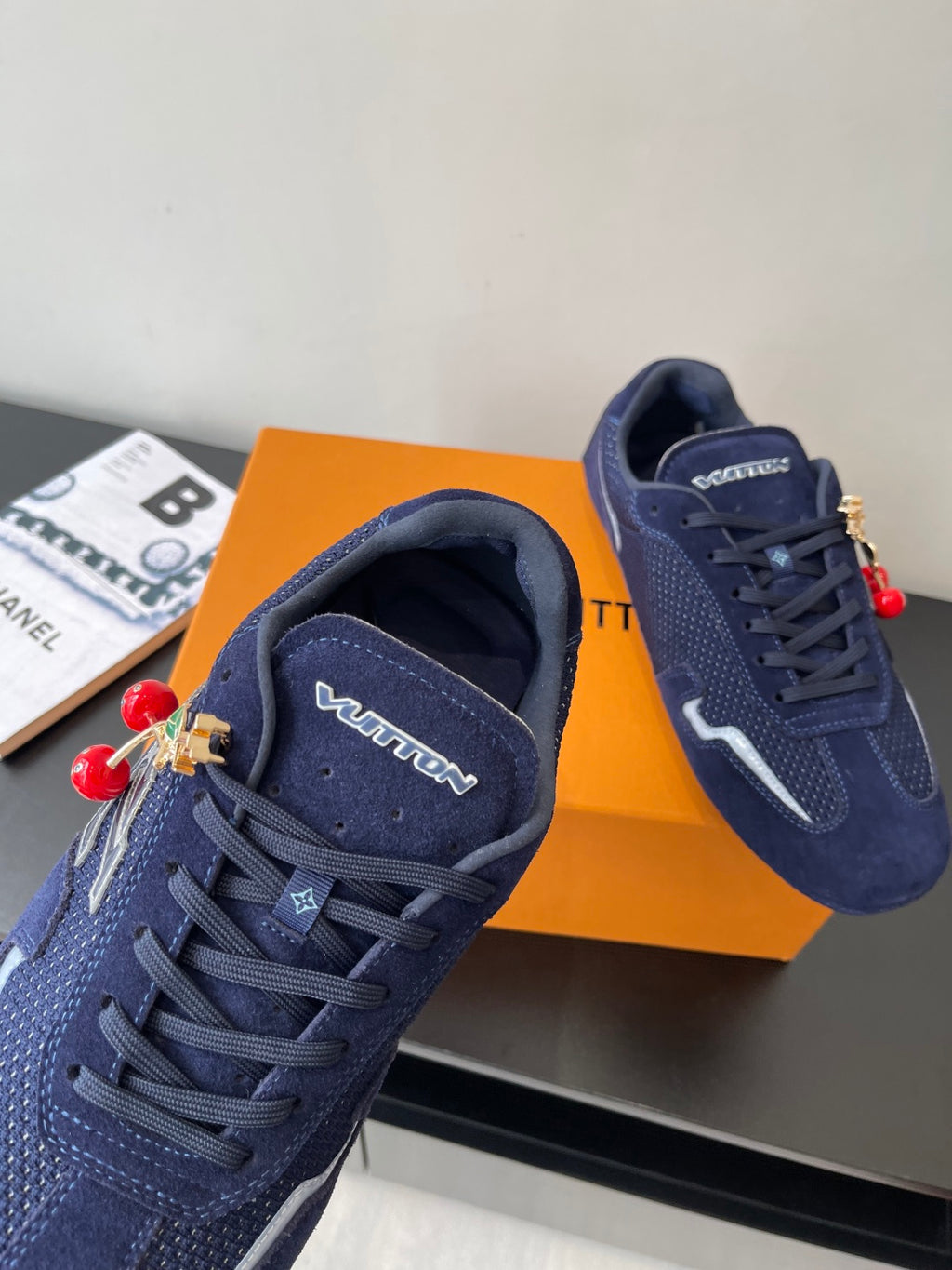 Louis Vuitton ladies navy sneakers, close-up of toe and lace-up with side branding