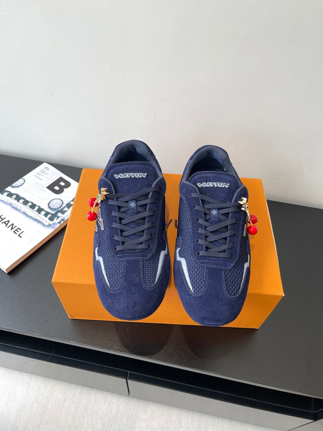 Louis Vuitton ladies navy sneakers with lace-up front and colorful charm accents