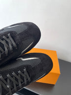 Black Louis Vuitton sneakers, close-up of textured side panel and laces