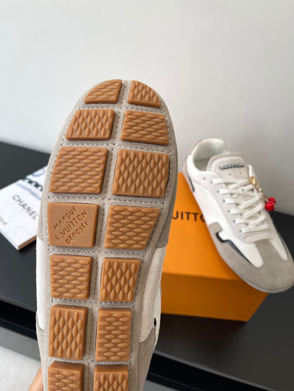 Louis Vuitton sneaker soles, tan rubber tread grid with brand stamp