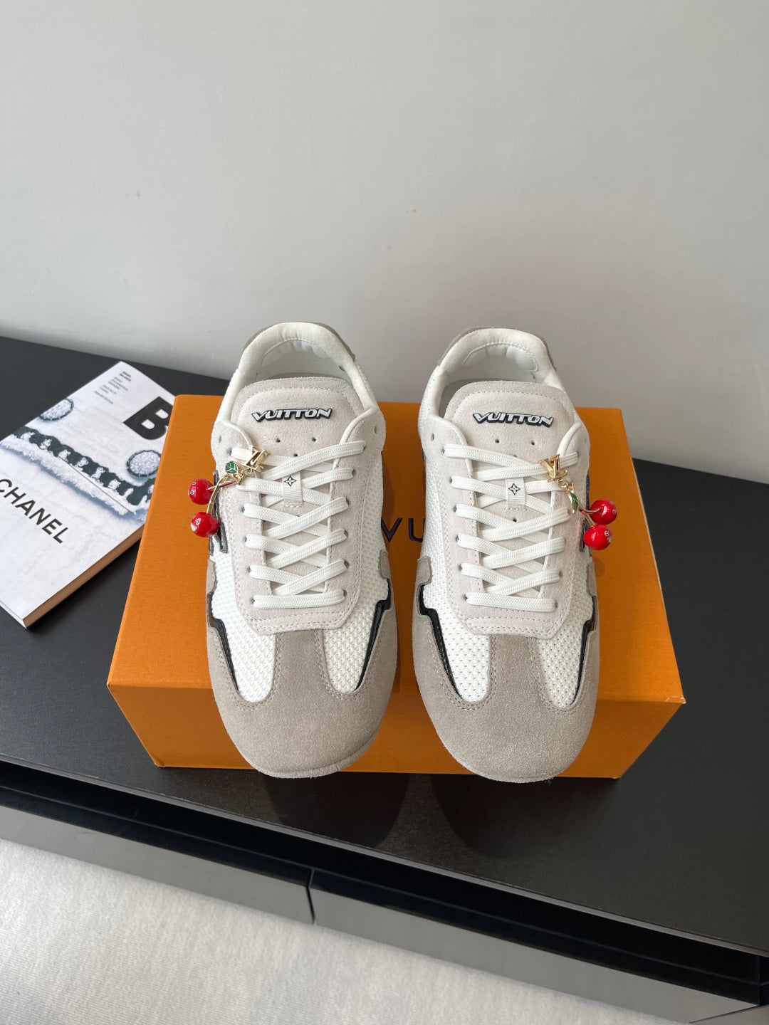 Pair of Louis Vuitton low-top sneakers, white laces, off-white and gray panels