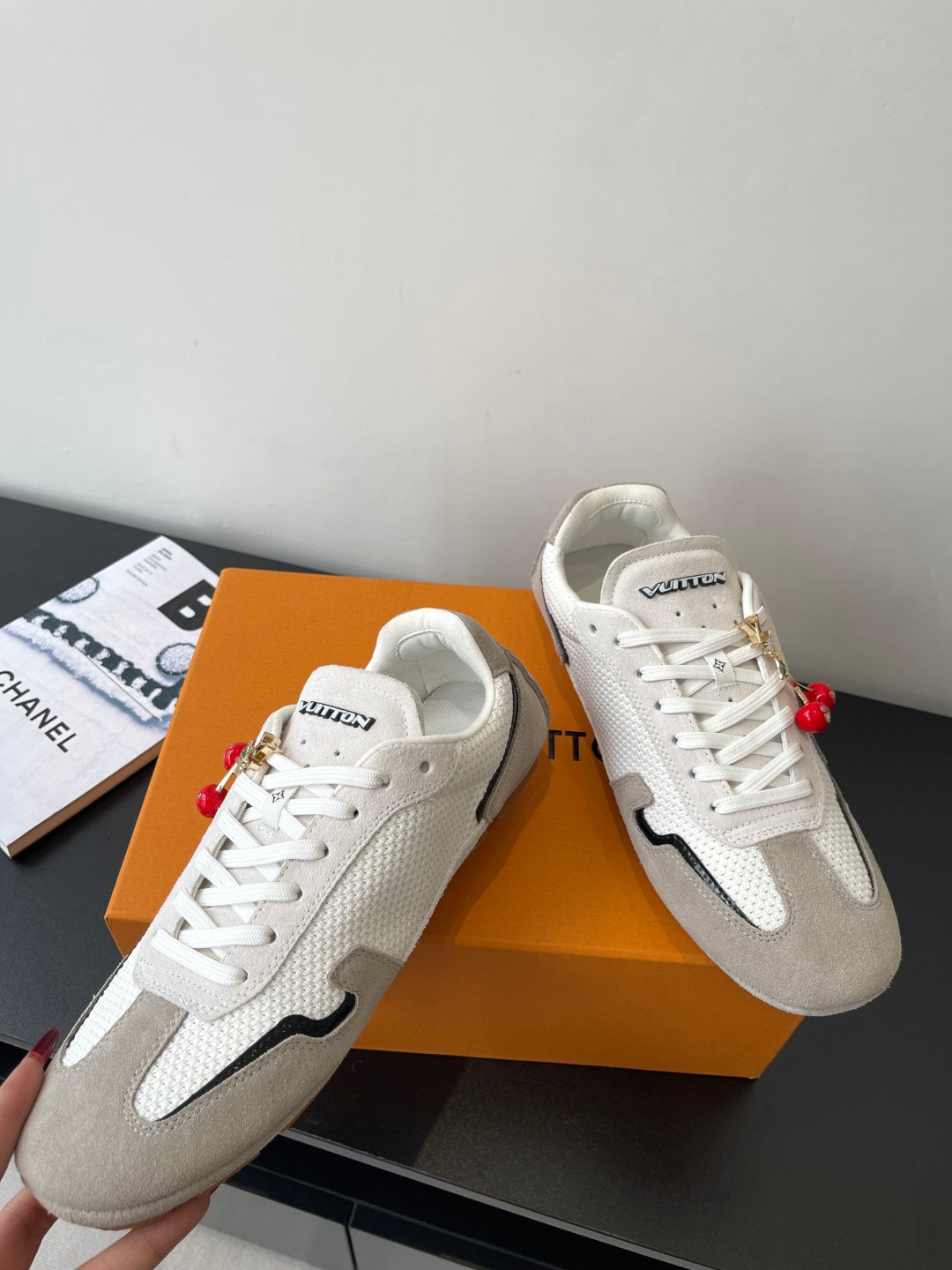 Louis Vuitton low-top sneakers, white laces, off-white and gray with red ornament