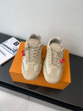 Beige Louis Vuitton ladies lace-up sneakers with textured panels and logo patch