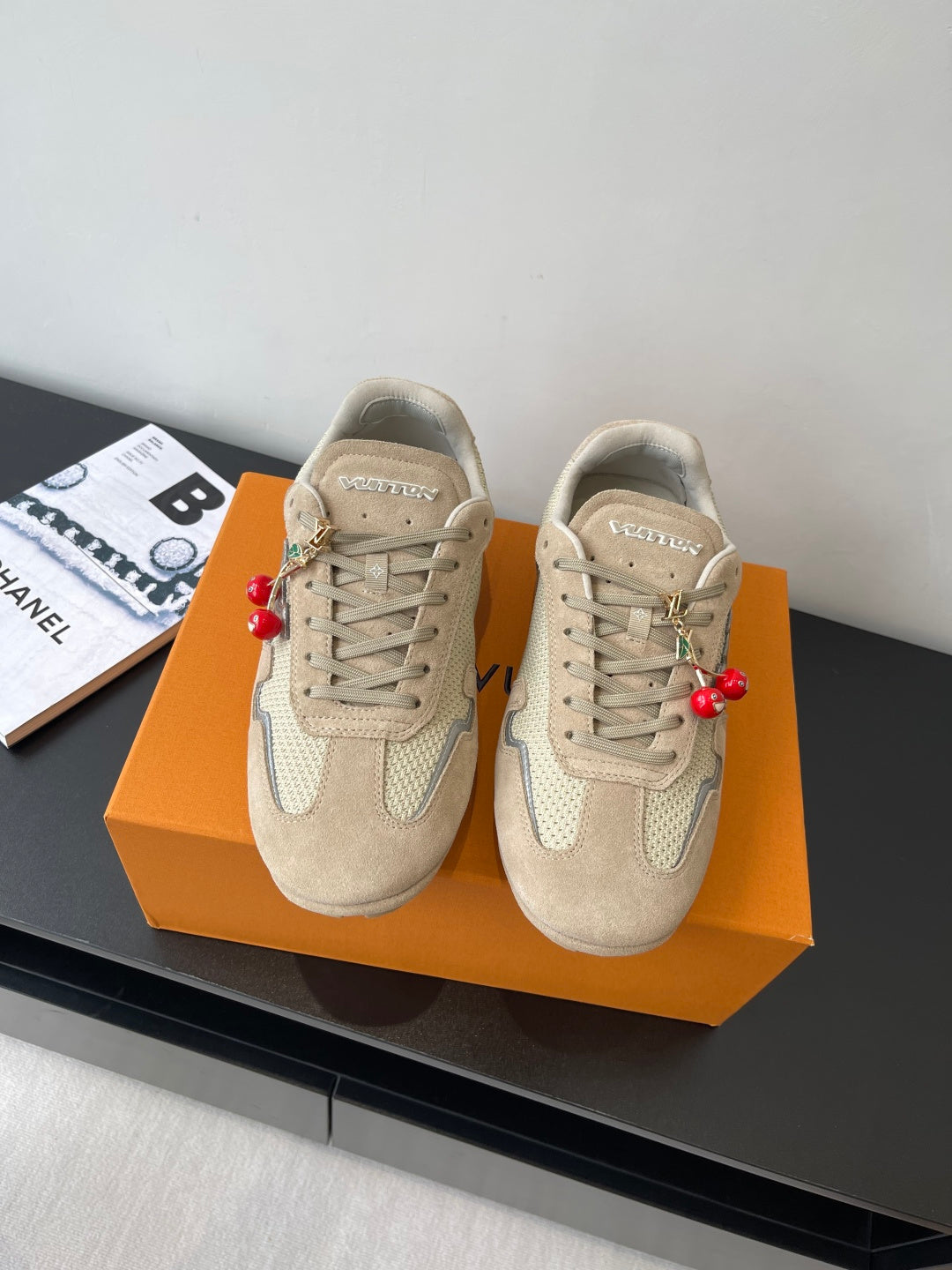 Beige Louis Vuitton ladies lace-up sneakers with textured panels and logo patch