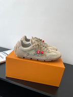 Beige Louis Vuitton ladies lace-up sneakers, side view with cherry charms