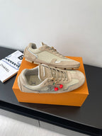 Beige Louis Vuitton ladies lace-up sneakers on display, front and side views