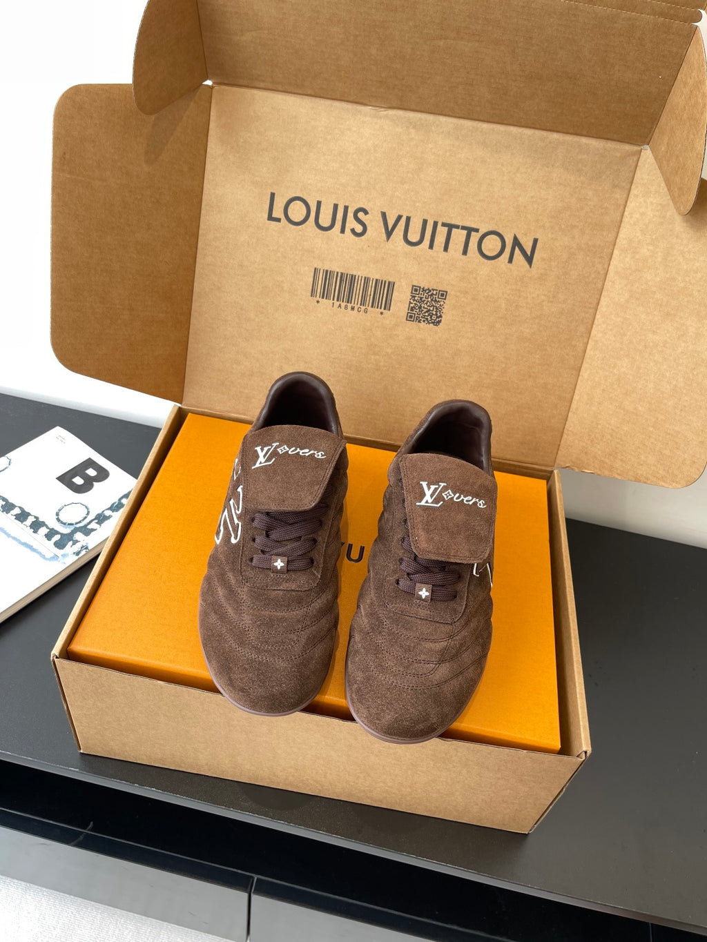 Brown suede lace-up sneakers with LV logo and star details