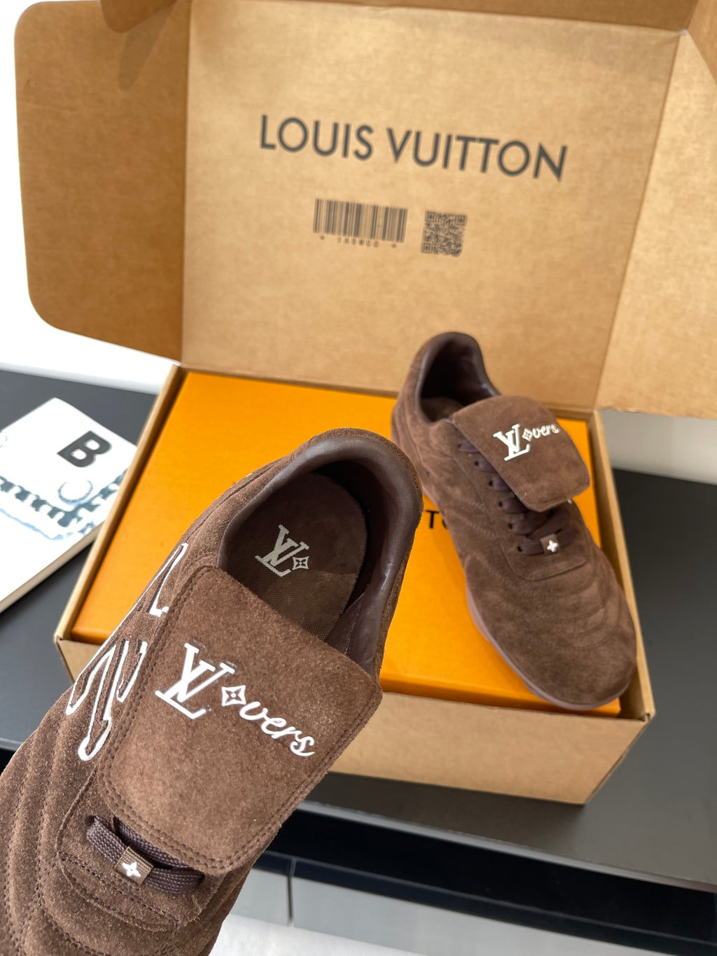 Brown suede lace-up sneakers with LV signature embroidery