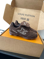 Brown suede lace-up sneakers with bold LV pattern on side