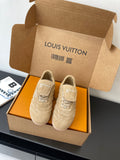 Beige Louis Vuitton women’s sneakers in box, paired shoes with lace-up front