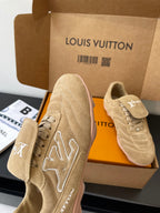 Beige Louis Vuitton women’s sneakers, one close-up showing star-shaped LV embroidery