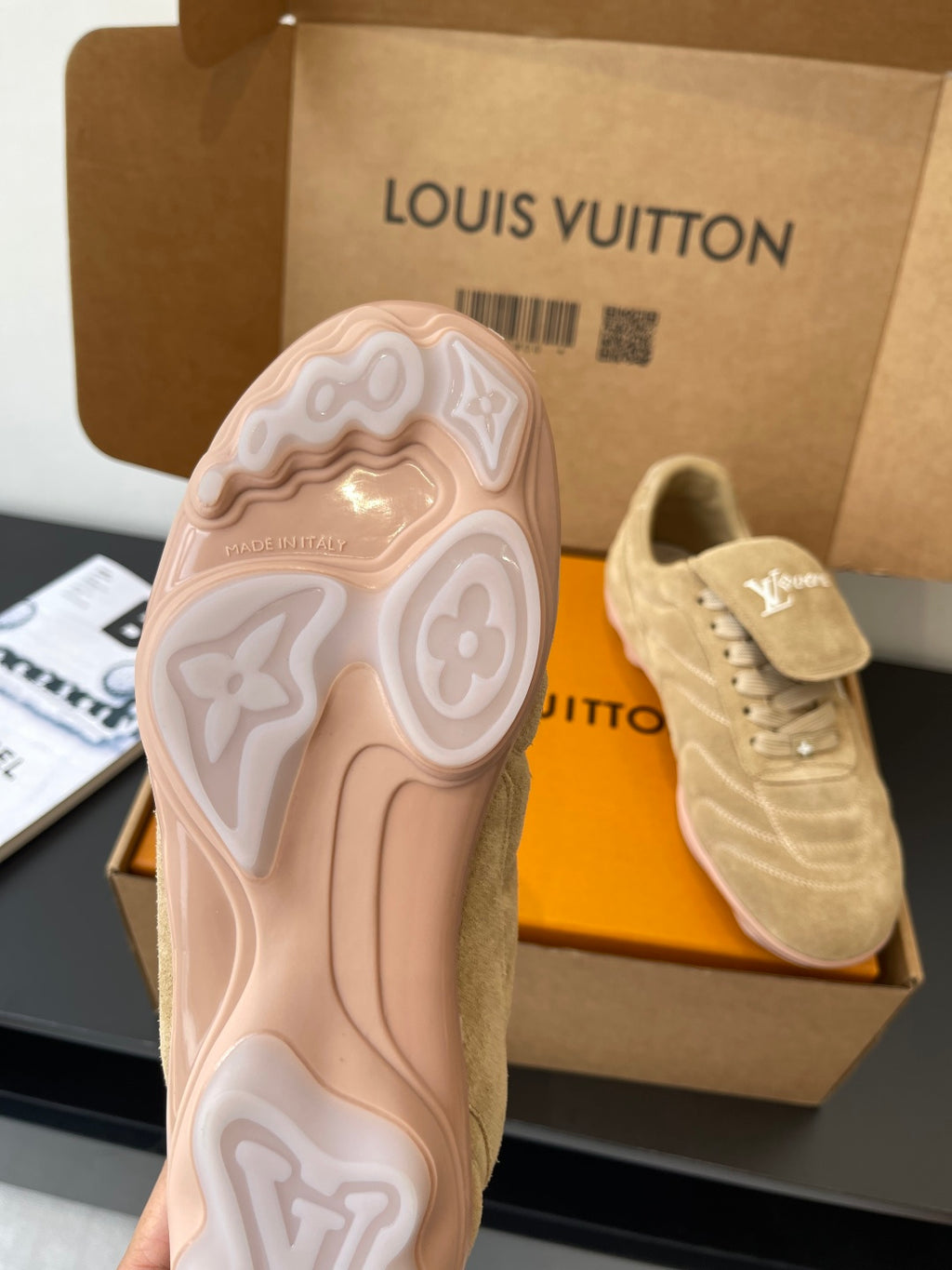 Beige Louis Vuitton women’s sneaker outsole with patterned tread and LV logo
