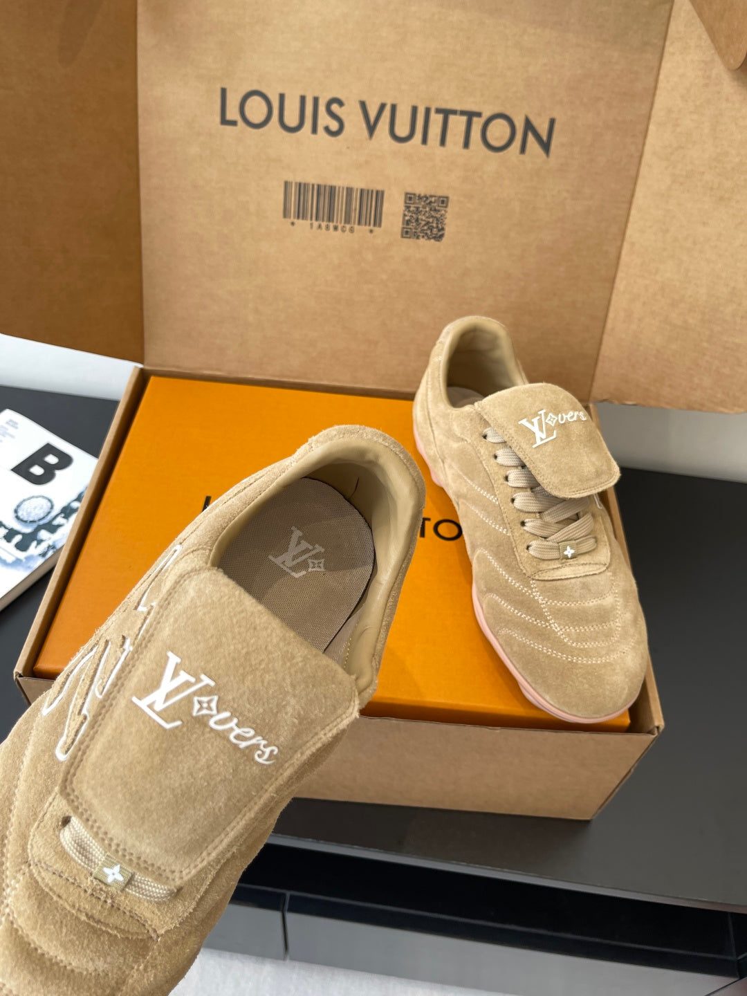 Beige Louis Vuitton women’s sneakers with embroidered LV on sides and tongue