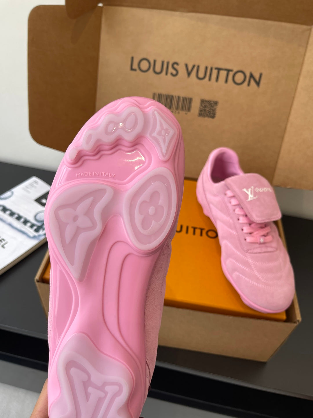 Louis Vuitton women's pink sneakers, outsole view in open box