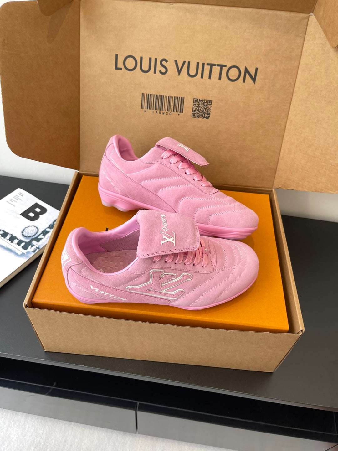 Louis Vuitton women's pink sneakers in box, front view with lace and logo