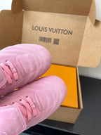 Louis Vuitton women's pink sneakers close-up, laces and textured knit upper