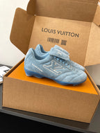 Light blue lace-up sneaker with Louis Vuitton logo, side view in open box