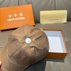 Louis Vuitton monogram baseball cap, beige front view with white button on top