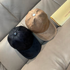 Pair of Louis Vuitton monogram baseball caps: beige and dark with curved brims