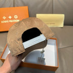 Louis Vuitton monogram cap with beige crown and adjustable strap detail