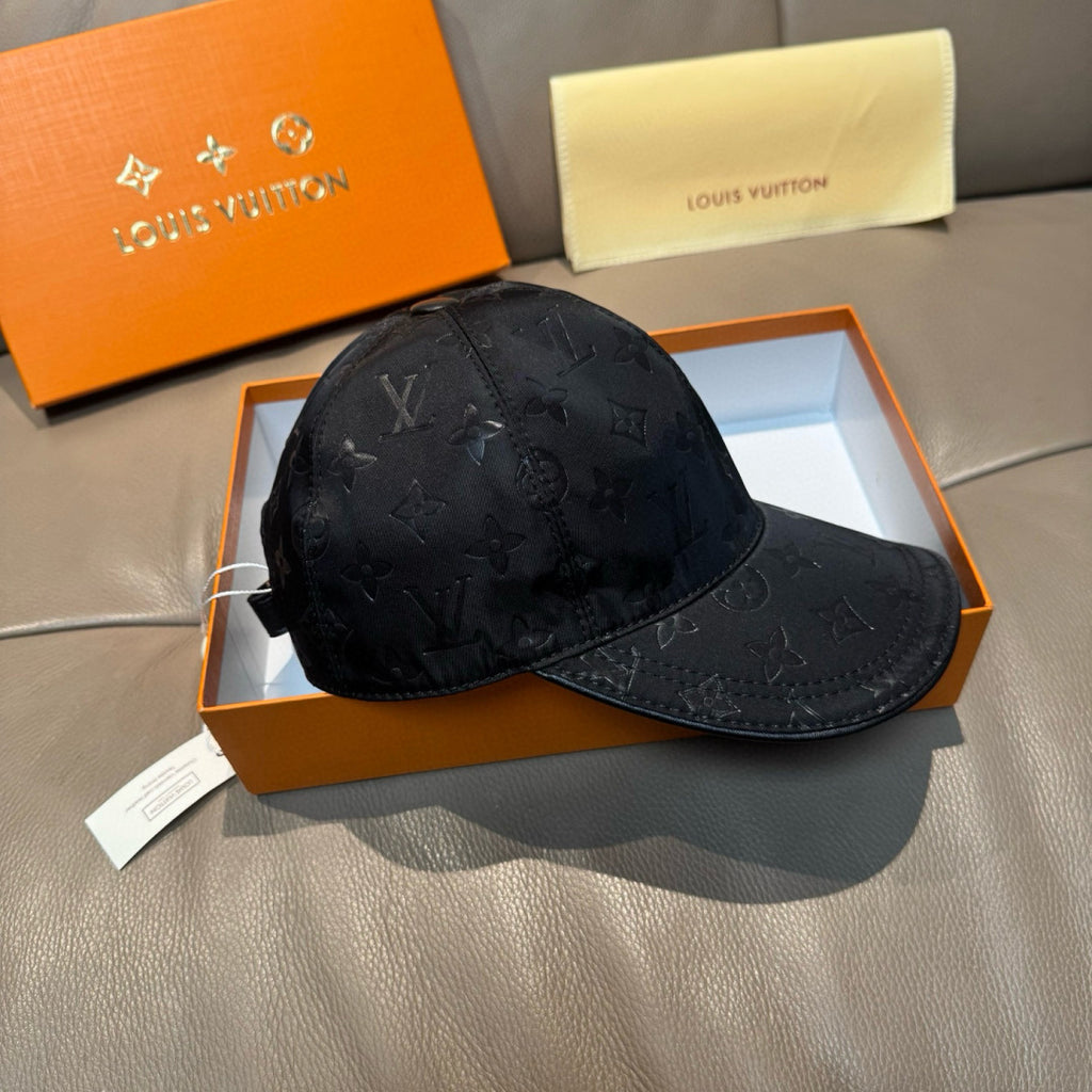 Louis Vuitton monogram baseball cap in dark black, angled view with curved brim