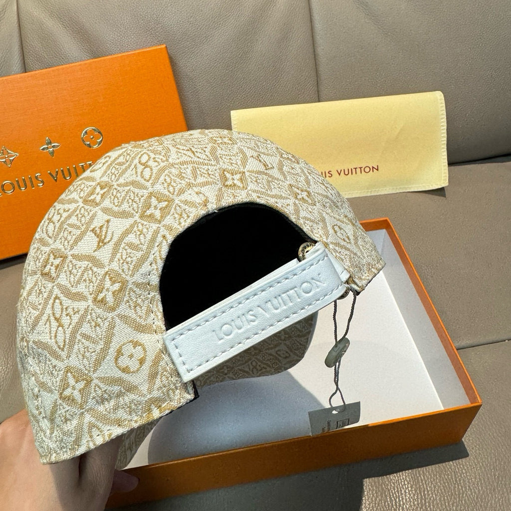 Louis Vuitton monogram baseball cap with black interior panel and light-blue strap tab