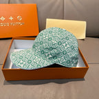 Louis Vuitton cap with green monogram pattern, front view, curved brim